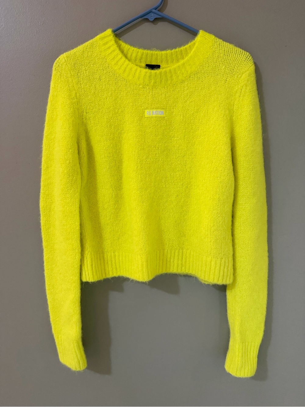 P.E Nation Alpaca Wool Fluoro Jumper features a vibrant neon yellow color small